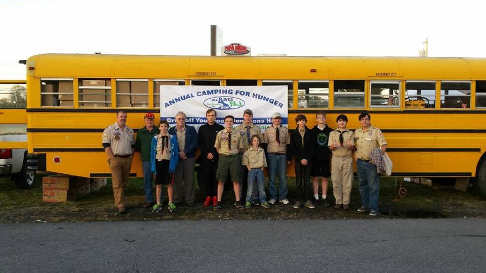 COURTESY PHOTOS/THE RIVER 95.3 For one week each year, The River 95-3 ‘Camping for Hunger’ bus is ground zero for the holiday spirit of giving in this community. Scout Troop 52’s Venture Club was among the visitors helping stock the bus.